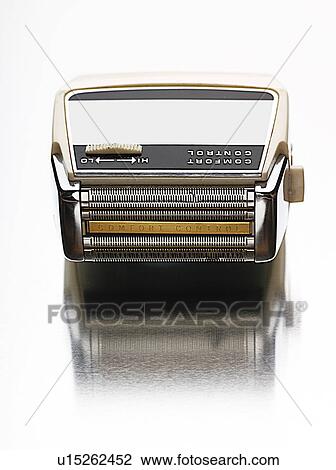 Stock Image - Electric shaver view from above studio shot. Fotosearch