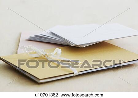 Stock Image - Envelopes and paper stationery elevated view close up studio shot. Fotosearch