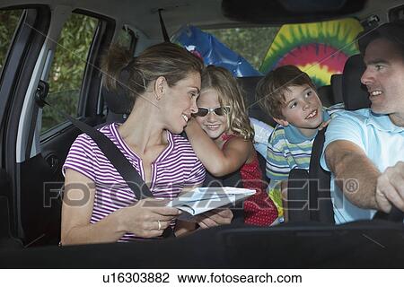 Family with two children (5-6) in car interior talking View Large Photo Image Stock Image - Family with two children (5-6) in car interior talking. Fotosearch