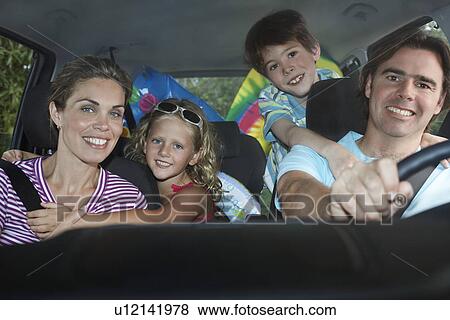 Family with two children (5-6) in car interior portrait View Large Photo Image Stock Photo - Family with two children (5-6) in car interior portrait. Fotosearch