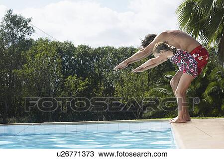 Father and daughter (5-6) preparing to dive into pool View Large Photo Image Stock Image - Father and daughter (5-6) preparing to dive into pool. Fotosearch