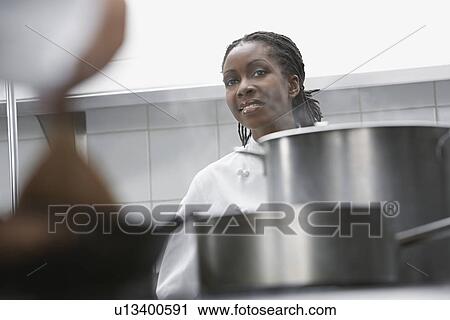 Female chef in kitchen View Large Photo Image Stock Image - Female chef in kitchen. Fotosearch