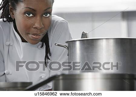 Female chef near saucepan in kitchen portrait View Large Photo Image Stock Image - Female chef near saucepan in kitchen portrait. Fotosearch