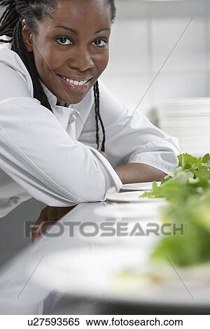 Female chef with plates of salad in kitchen portrait View Large Photo Image Stock Photography - Female chef with plates of salad in kitchen portrait. Fotosearch