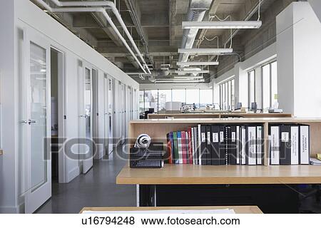 Folders on desk in empty office View Large Photo Image Stock Photo - Folders on desk in empty office. Fotosearch