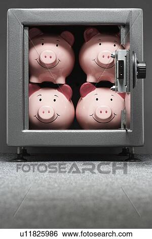 Four piggy banks in safe View Large Photo Image Stock Photograph - Four piggy banks in safe. Fotosearch