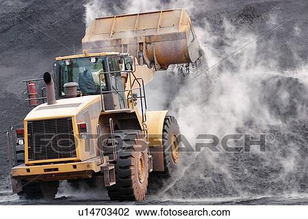 Front loader dumping mineral material on heap View Large Photo Image Stock Image - Front loader dumping mineral material on heap. Fotosearch