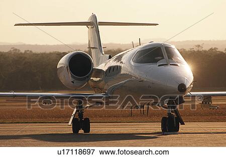 Front view Lear jet on tarmac View Large Photo Image Stock Photo - Front view Lear jet on tarmac. Fotosearch