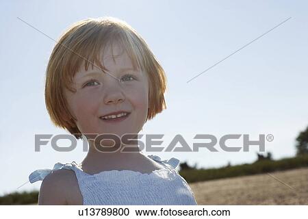 Girl (5-6) at beach portrait View Large Photo Image Stock Image - Girl (5-6) at beach portrait. Fotosearch