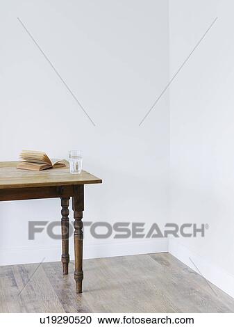 Glass of water and open book in room View Large Photo Image Stock Image - Glass of water and open book in room. Fotosearch
