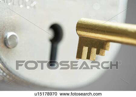 Golden key and padlock close-up selective focus View Large Photo Image Stock Image - Golden key and padlock close-up selective focus. Fotosearch