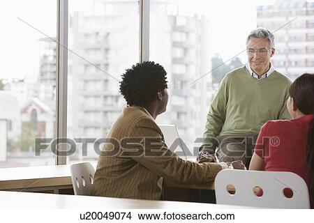 Group of business colleugues at office meeting View Large Photo Image Picture - Group of business colleugues at office meeting. Fotosearch
