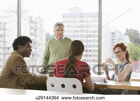 Group of business colleugues at office meeting View Large Photo Image Picture - Group of business colleugues at office meeting. Fotosearch