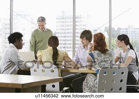 Group of business colleugues at office meeting View Large Photo Image Stock Image - Group of business colleugues at office meeting. Fotosearch