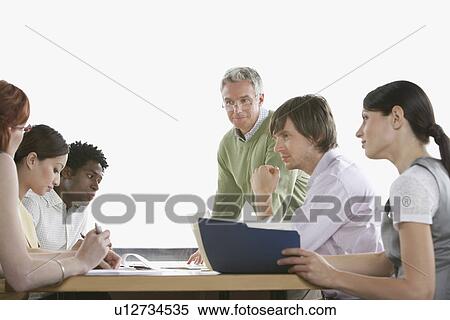 Group of business colleugues at office meeting View Large Photo Image Stock Photography - Group of business colleugues at office meeting. Fotosearch
