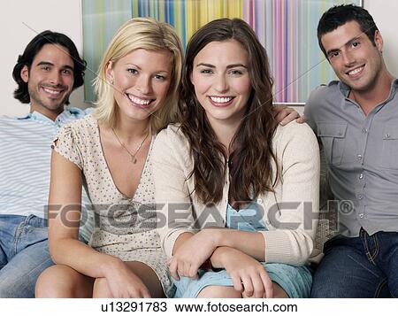 Group of young people sitting in row on sofa portrait View Large Photo Image Stock Image - Group of young people sitting in row on sofa portrait. Fotosearch