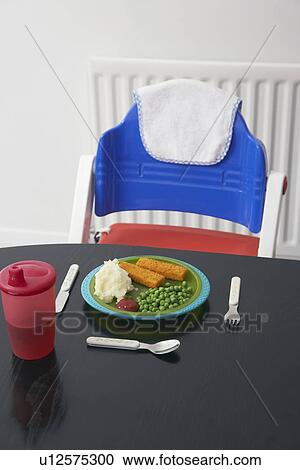 High chair at table with child's dinner View Large Photo Image Stock Image - High chair at table with child's dinner. Fotosearch