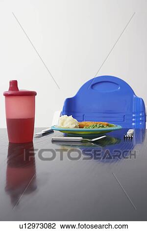 High chair at table with child's dinner close-up View Large Photo Image Stock Image - High chair at table with child's dinner close-up. Fotosearch
