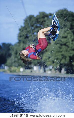 Stock Photography - Kitesurfer jumping. Fotosearch