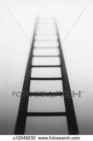 Stock Image - Ladder leading to light source. Fotosearch