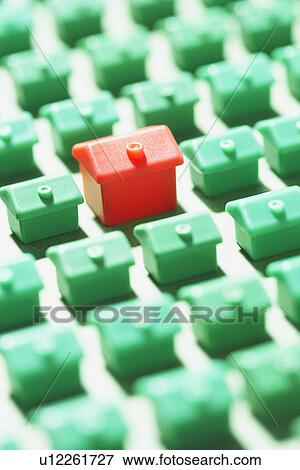 Large group of green model houses with one red in middle close-up View Large Photo Image Stock Photo - Large group of green model houses with one red in middle close-up. Fotosearch