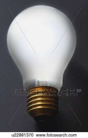 Light bulb on black background close-up View Large Photo Image Stock Image - Light bulb on black background close-up. Fotosearch