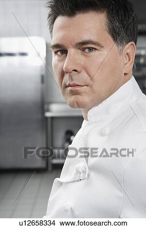 Male chef in kitchen portrait View Large Photo Image Picture - Male chef in kitchen portrait. Fotosearch