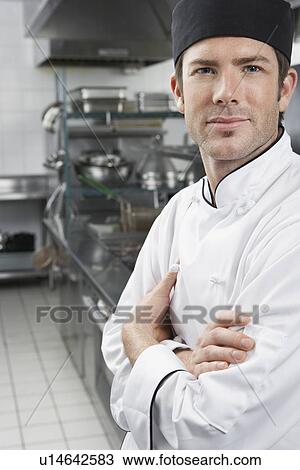 Male chef with arms crossed in kitchen portrait View Large Photo Image Stock Image - Male chef with arms crossed in kitchen portrait. Fotosearch