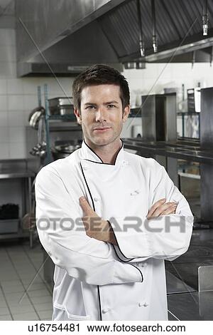 Male chef with arms crossed in kitchen portrait View Large Photo Image Stock Image - Male chef with arms crossed in kitchen portrait. Fotosearch