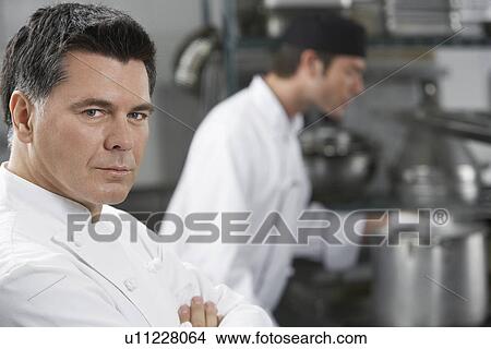 Male chef with colleague in kitchen portrait View Large Photo Image Picture - Male chef with colleague in kitchen portrait. Fotosearch