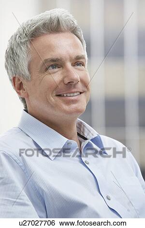 Stock Photograph - Man looking up smiling. Fotosearch