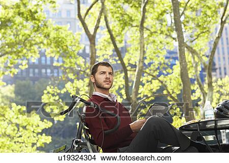 Man relaxing in park View Large Photo Image Picture - Man relaxing in park. Fotosearch