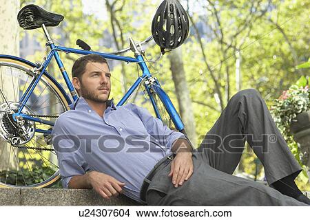 Man relaxing in park View Large Photo Image Picture - Man relaxing in park. Fotosearch