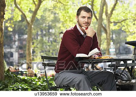 Man relaxing in park portrait View Large Photo Image Stock Photo - Man relaxing in park portrait. Fotosearch