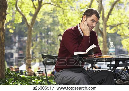 Stock Photo - Man relaxing in park. Fotosearch