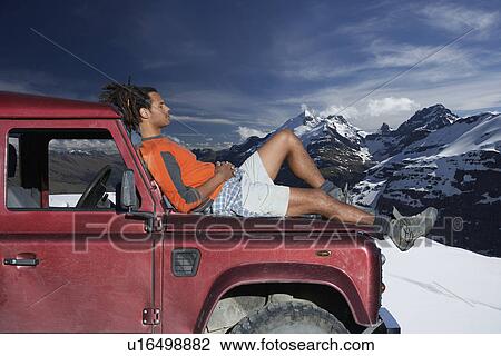 Man Resting on Car Hood View Large Photo Image Stock Image - Man Resting on Car Hood. Fotosearch