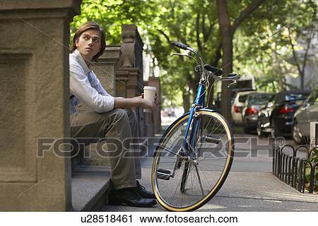 Man sitttng on stone steps View Large Photo Image Stock Image - Man sitttng on stone steps. Fotosearch