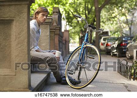 Man sitttng on stone steps View Large Photo Image Stock Photo - Man sitttng on stone steps. Fotosearch