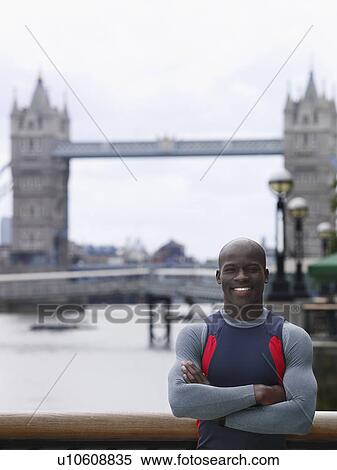 Man standing in front of Tower Bridge England London View Large Photo Image Stock Photography - Man standing in front of Tower Bridge England London. Fotosearch