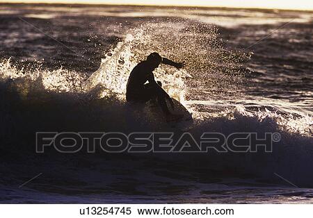 Man surfing wave silhouette View Large Photo Image Stock Photography - Man surfing wave silhouette. Fotosearch
