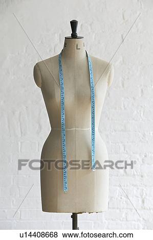 Mannequin with hanging measuring tape indoors View Large Photo Image Stock Photo - Mannequin with hanging measuring tape indoors. Fotosearch
