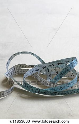 Measuring tape on table elevated view View Large Photo Image Stock Image - Measuring tape on table elevated view. Fotosearch