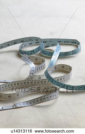 Stock Photograph - Measuring tape on table. Fotosearch