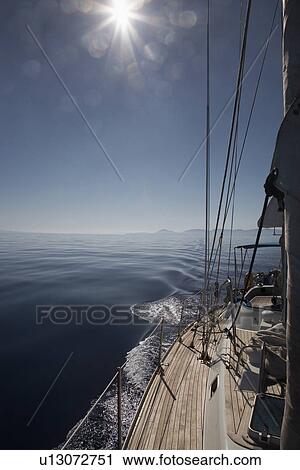 Mountain shore from sailboat deck View Large Photo Image Stock Image - Mountain shore from sailboat deck. Fotosearch