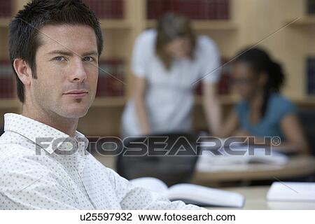 Office worker in office portrait View Large Photo Image Stock Image - Office worker in office portrait. Fotosearch