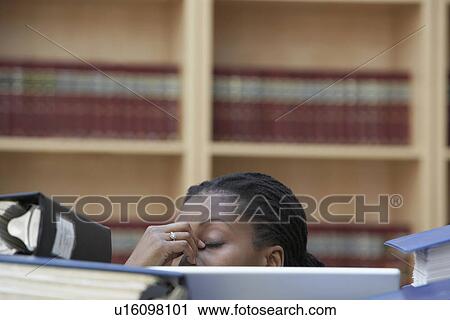 Office worker sitting behind stacks of documents in office high section View Large Photo Image Stock Image - Office worker sitting behind stacks of documents in office high section. Fotosearch