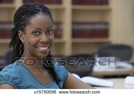 Office worker sitting in office portrait View Large Photo Image Stock Photograph - Office worker sitting in office portrait. Fotosearch