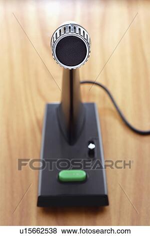 Old fashioned microphone on desk elevated view focus on foreground View Large Photo Image Stock Photo - Old fashioned microphone on desk elevated view focus on foreground. Fotosearch