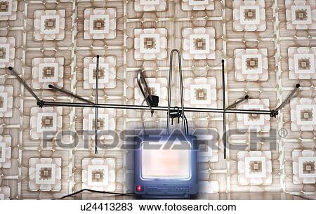 Stock Image - Old fashioned tv set with antenna wallpaper with pattern. Fotosearch
