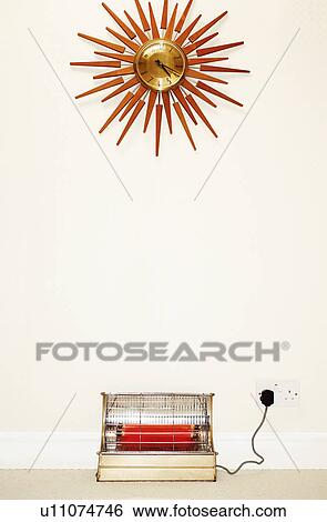 Old fashioned wall clock and heater View Large Photo Image Stock Photograph - Old fashioned wall clock and heater. Fotosearch